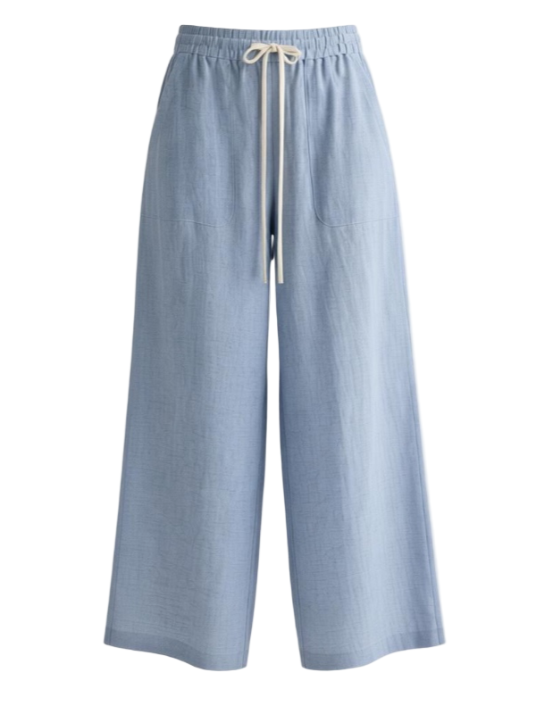 Main Street Pant in Light Indigo by TWP, showcasing its relaxed wide-leg design and elastic waistband.