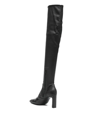 The Over-the-knee Boot in Black, designed by TOTEME, perfect for pairing with dresses and skirts.