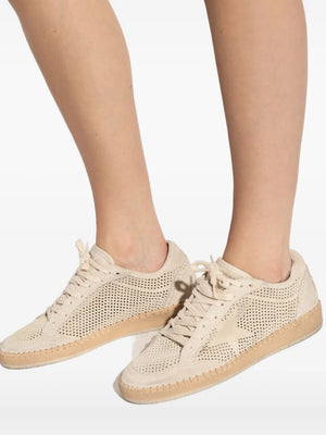 Lifestyle image of the Golden Goose Ball Star Perforated Suede sneakers in Seed Pearl, perfect for casual streetwear.