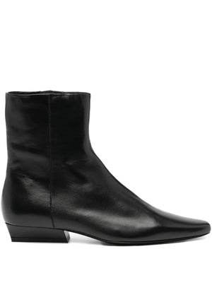 Stylish Wally Flat Ankle Boot in Black by Staud with a pointed rectangular toe and interior zipper.