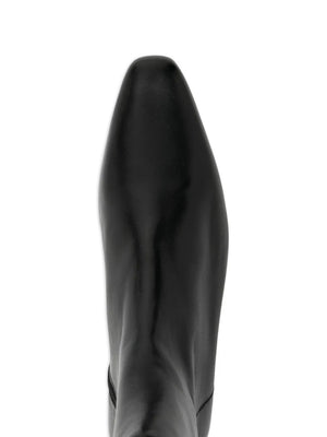 Side view of Wally Flat Ankle Boot in Black exhibiting its 25mm heel and elegant silhouette.