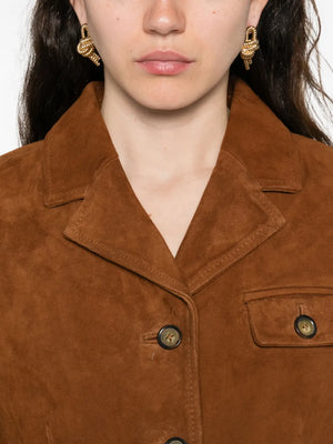 Detail shot of the Suede Fitted Jacket in Hazelnut, showcasing the front pockets and refined stitching.