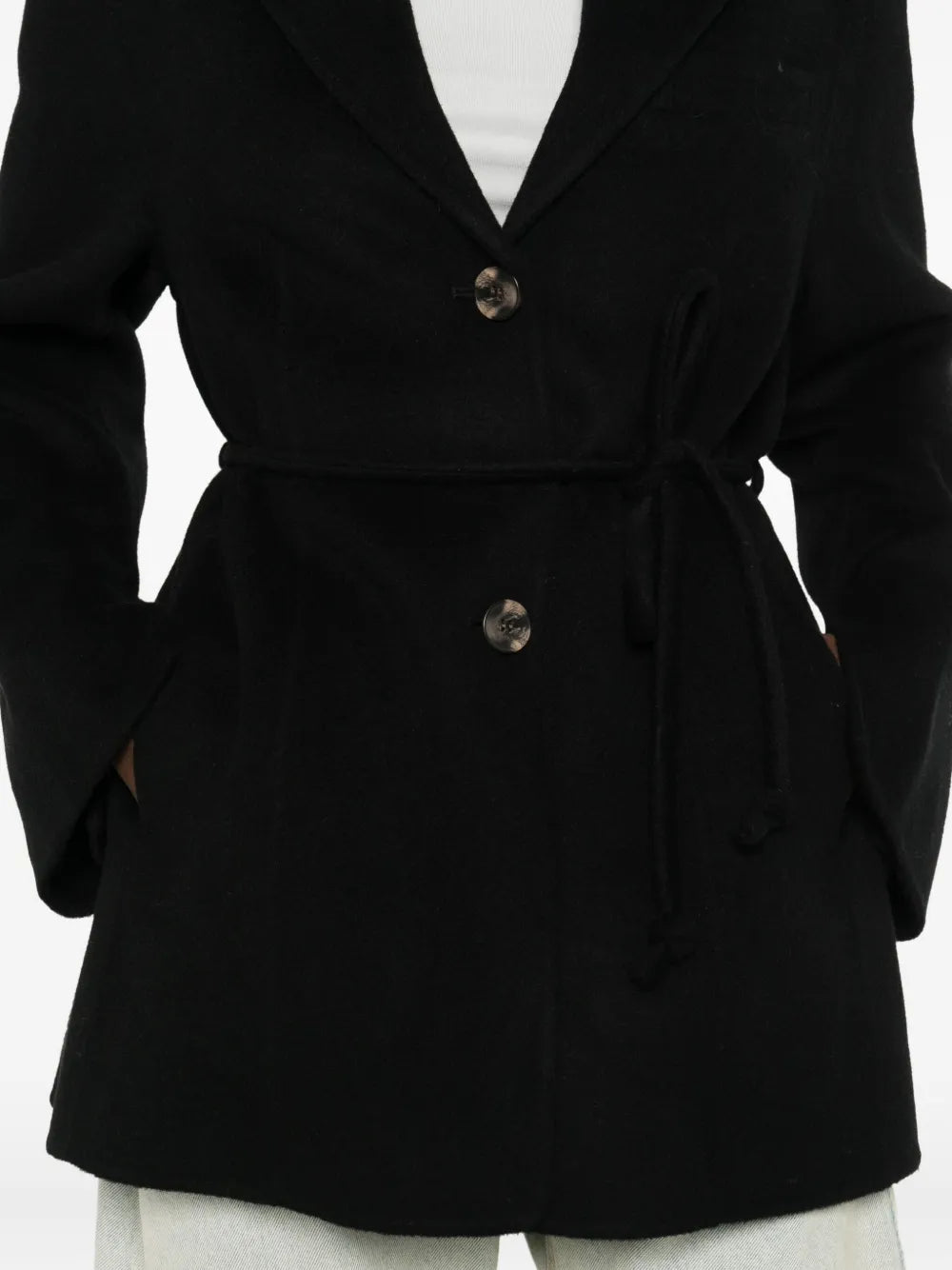 Laying flat, the Hellen Blazer in Black by By Malene Birger displays its elegant shape and front pockets.