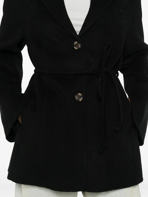 Laying flat, the Hellen Blazer in Black by By Malene Birger displays its elegant shape and front pockets.