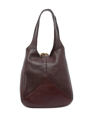The unique rounded silhouette of the Small Chloé Balloon Bag in Grenat, perfect for any casual outfit.