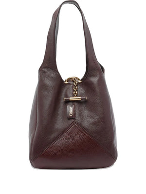 Small Chloé Balloon Bag in Grenat, showcasing its beautiful patchwork of grained buffalo leather and cowhide.