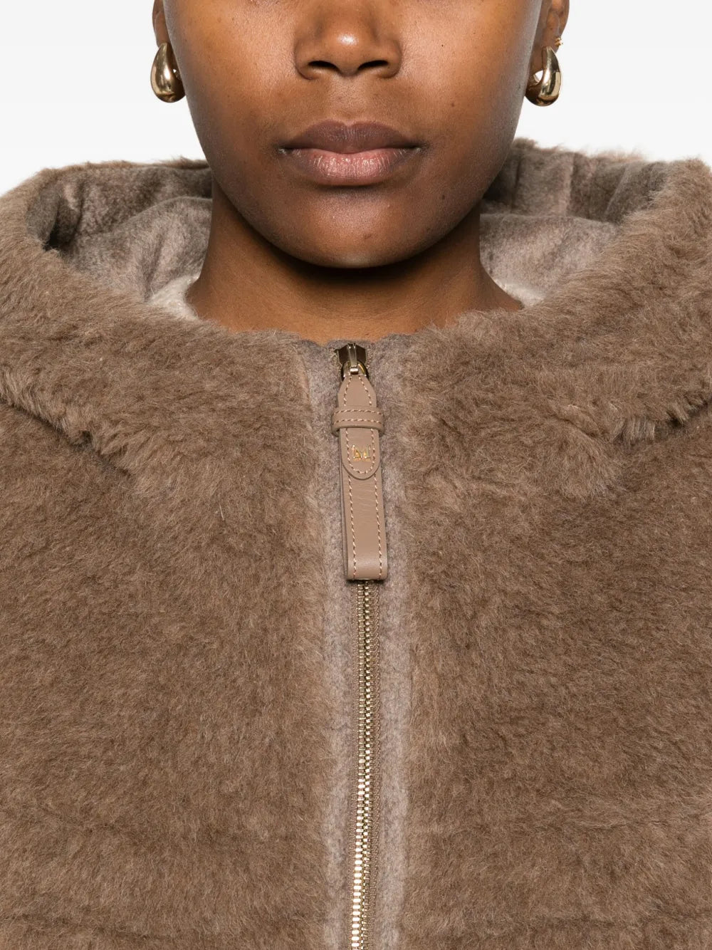 Model wearing the Max Mara Petal04 Cape in Brown, demonstrating its trendy and cozy look.