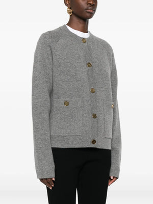 Back view of the Hammered Botton Cardigan in Grey Melange, highlighting its double-sided construction and cozy fit.