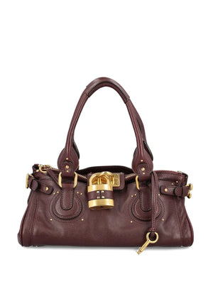 Chloé Paddington Bag in Grenat showcasing the slouchy silhouette and grained buffalo leather craftsmanship.