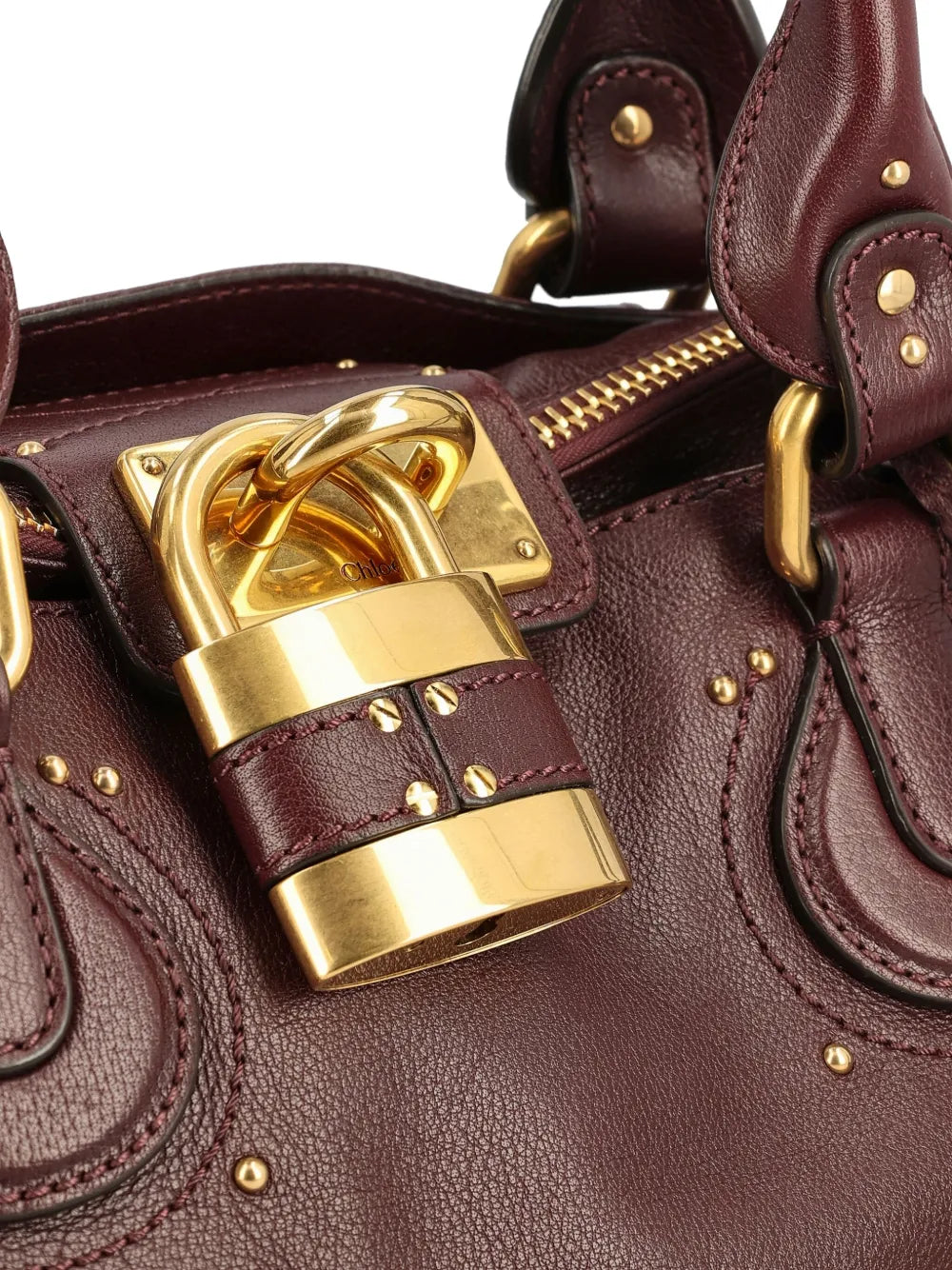 Stylish display of the Chloé Paddington Bag in Grenat featuring the C-shaped buckles.