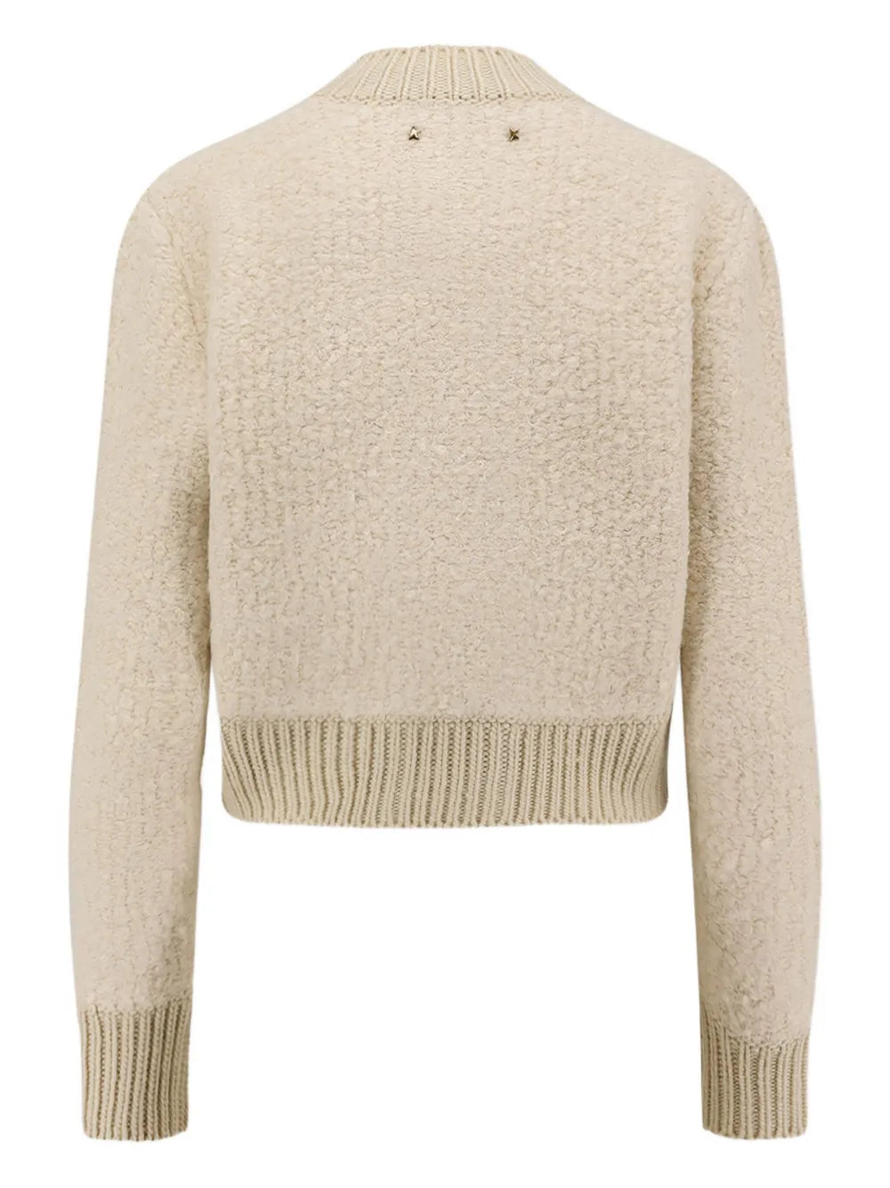Close-up of the Oxa Cardigan in Natural White, showcasing its wide rib cuffs and toggle buttons for a trendy look.