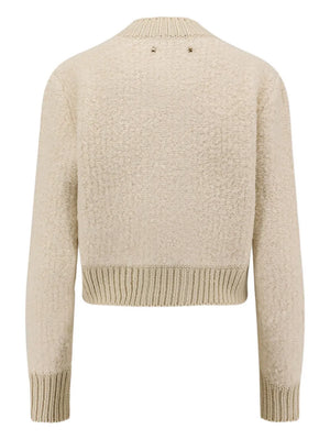 Close-up of the Oxa Cardigan in Natural White, showcasing its wide rib cuffs and toggle buttons for a trendy look.
