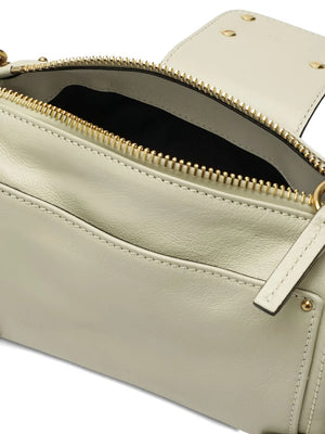 Styled shot of the Small Paddington Chain Bag in Cloudy Cream across a trendy outfit, perfect for everyday use.
