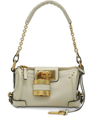 Small Paddington Chain Bag in Cloudy Cream featuring grained buffalo leather and oversized padlock detail.