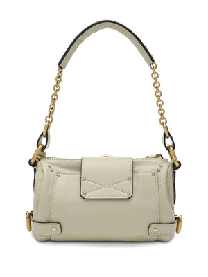 The iconic Small Paddington Chain Bag in Cloudy Cream displaying its slouchy silhouette and C-shaped buckles.