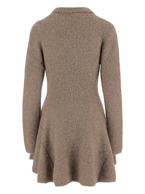 Close-up of the Balboa Volume Dress in Praline showcasing its modern knit design and rich texture.