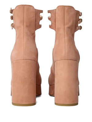 Loti Platform Pump in Peachy Pink displayed in a stylish setting, emphasizing its trendy square toe design.