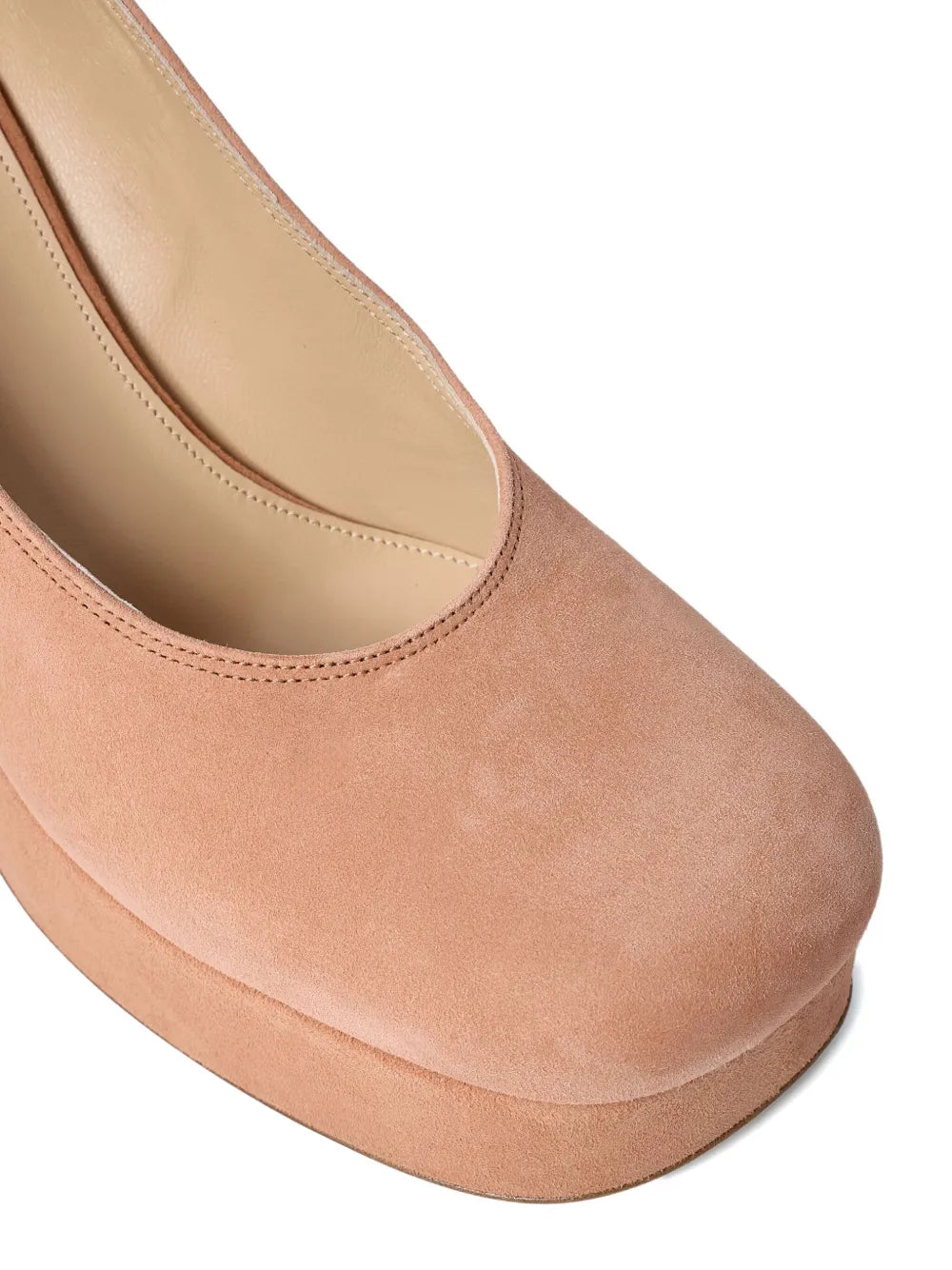 Loti Platform Pump in Peachy Pink from the side, featuring the luxurious lambskin inner and cowhide sole.