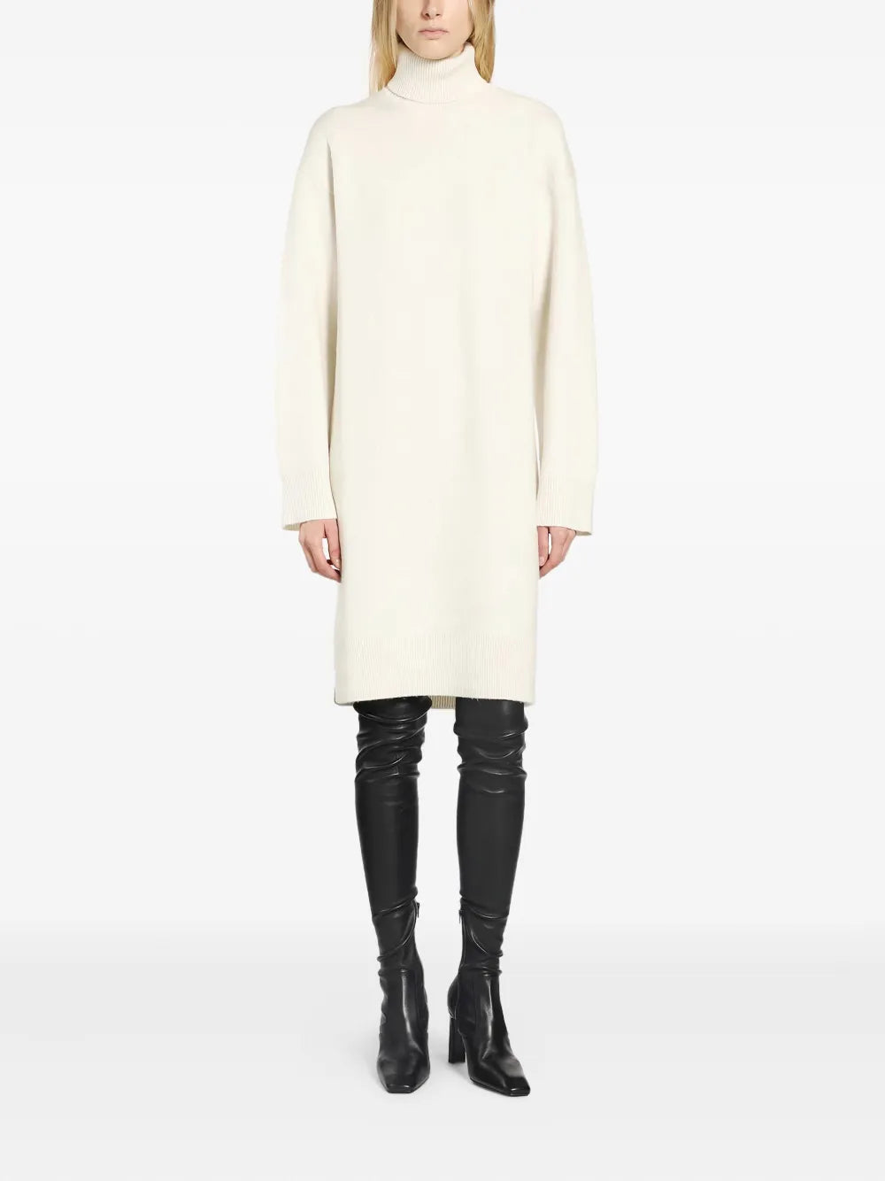 Close-up of the fabric texture of the Broad Turtleneck Dress in Milk, highlighting its cashmere and wool blend.