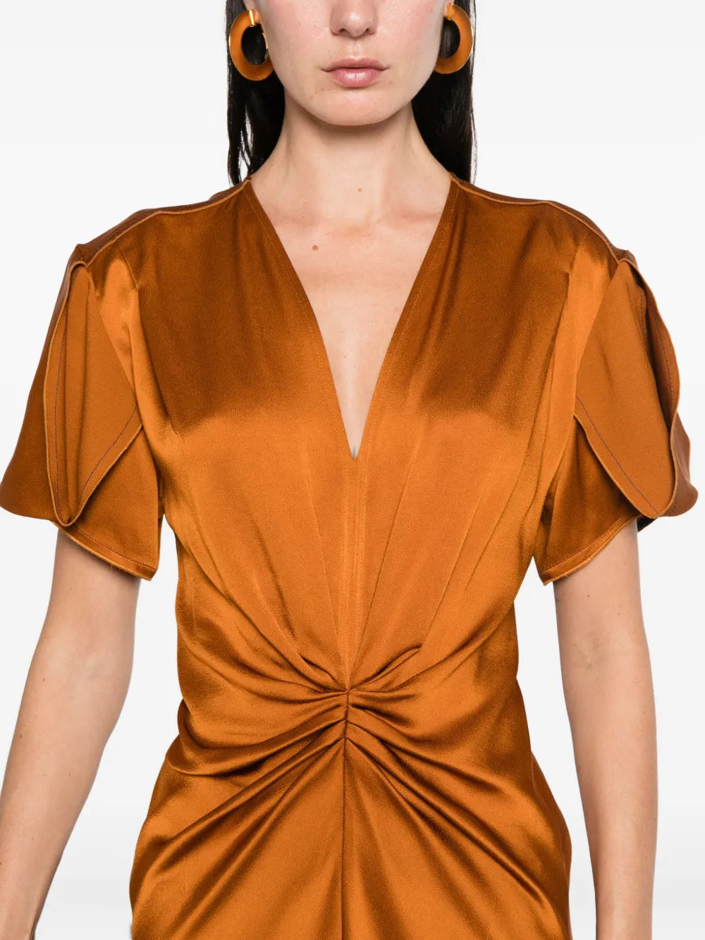 Eve Midi Dress in Bronze by Victoria Beckham on a hanger, illustrating the elegant cut and flattering fit of this designer piece.