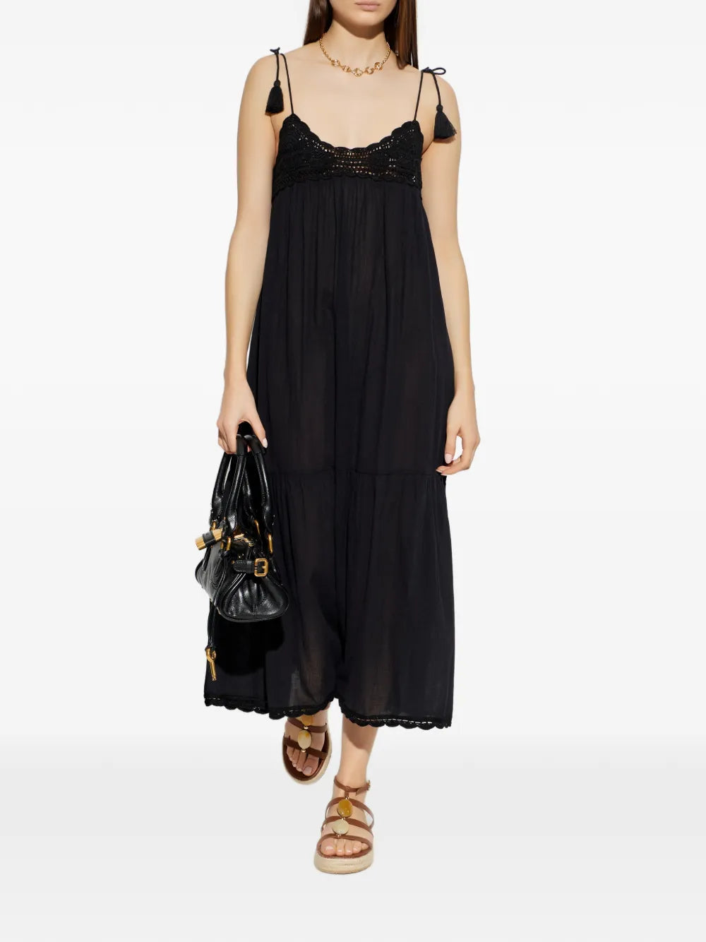 Ulla Johnson Linnea Coverup Dress in Noir - side view highlighting the airy volume of the lightweight black gauze fabric.