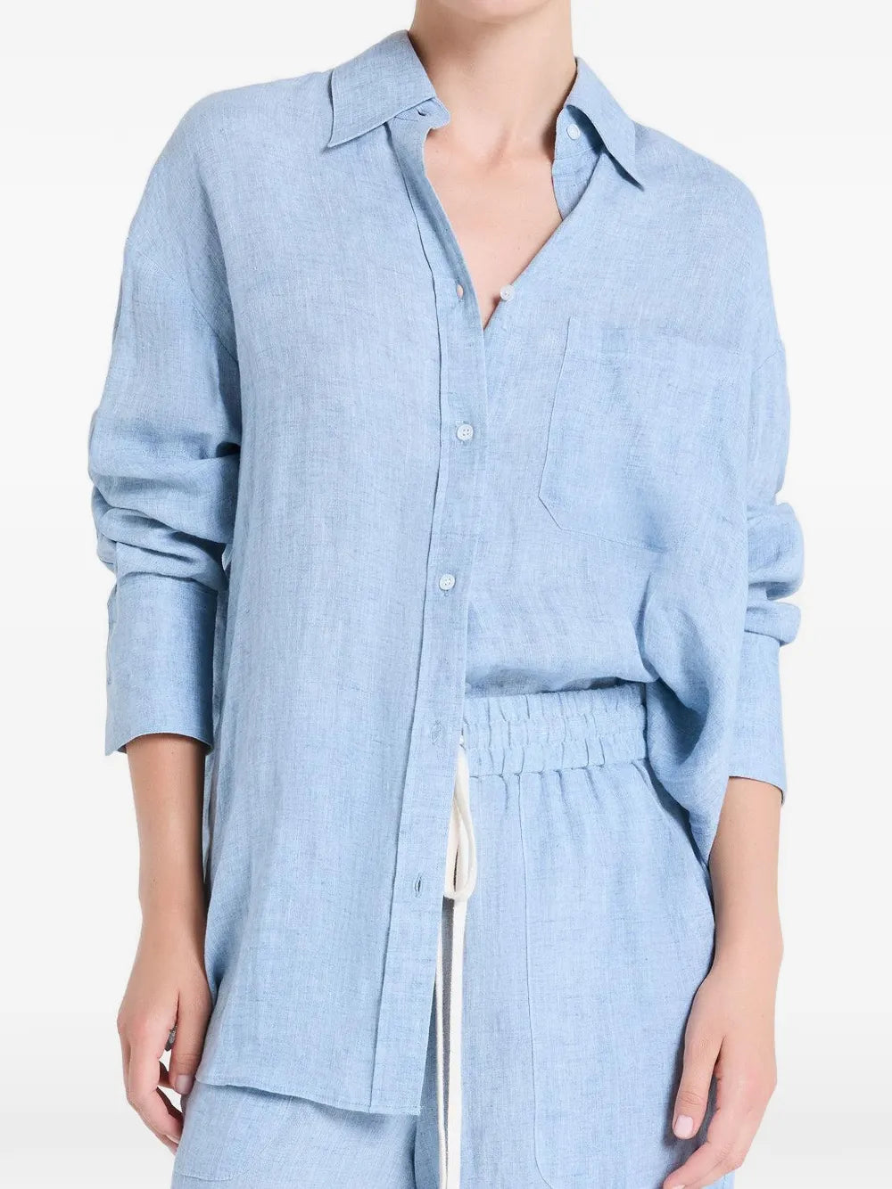 Model wearing the Big Joe Shirt in Light Indigo styled with french cuffs and a tulip hem.