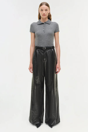 Close-up of Kobie Wide Leg Leather Pant in Black showcasing the leather texture and welt back pockets.