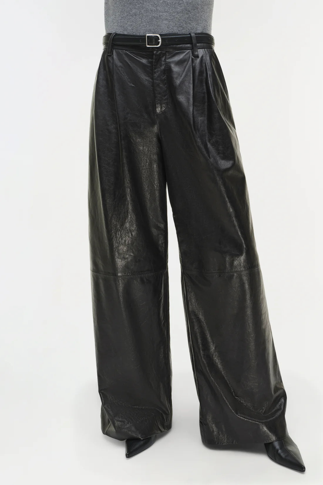 Kobie Wide Leg Leather Pant in Black laid flat to display its banded waist and pleated front.