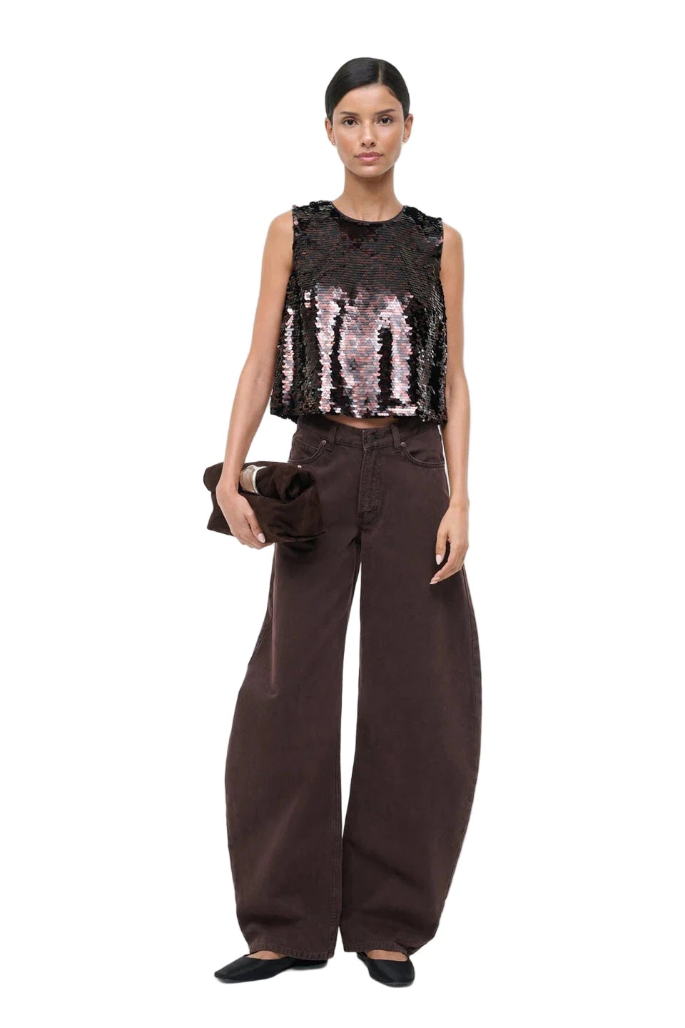 Lifestyle shot of the Staud Seraphina Tank in Espresso/Black in a stylish setting.