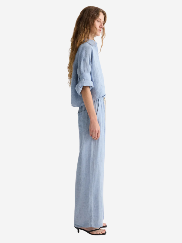 Lifestyle image of the Main Street in Light Indigo, highlighting the casual and comfortable fit of TWP's pants.