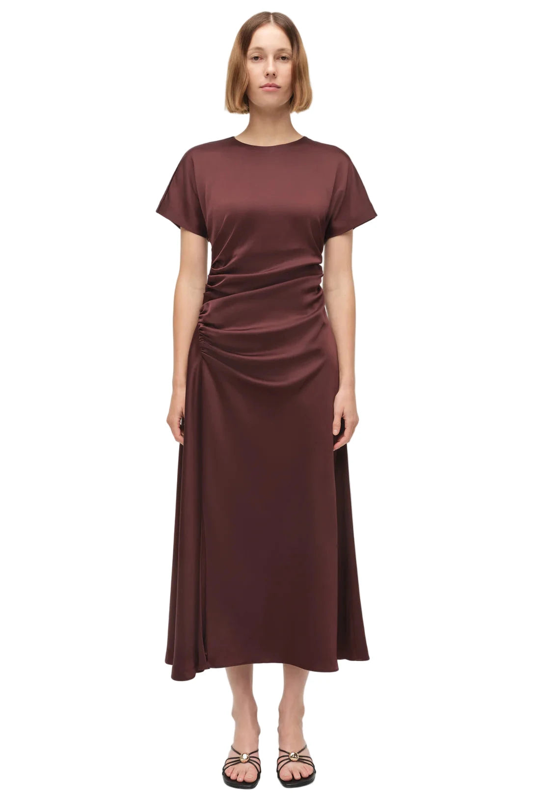 Details of the Marabella Draped Satin Midi Dress in Mahogany highlighting its fluid skirt and modern design.
