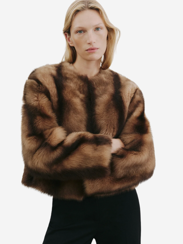 Elan Shearling Jacket in Camel/Brown displayed with a focus on the full lining and unique leather facing.