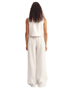 Model wearing the Rio Top in White, a trendy white crop top perfect for casual outings.