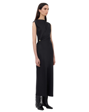 Full view of the Roan Draped Dress in Black, illustrating its fluid volume and stylish silhouette.