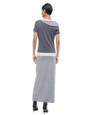 Model wearing the Staud Lyric Dress in Heather Grey Multi, demonstrating its layered effect and modern silhouette.