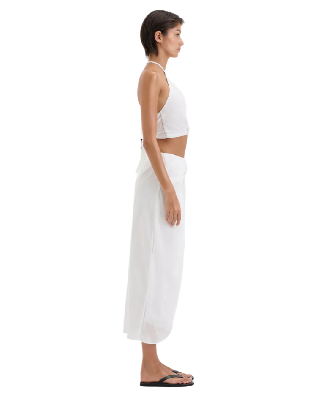 The Azura Midi Skirt in Ivory, a lightweight cotton garment perfect for casual outings.
