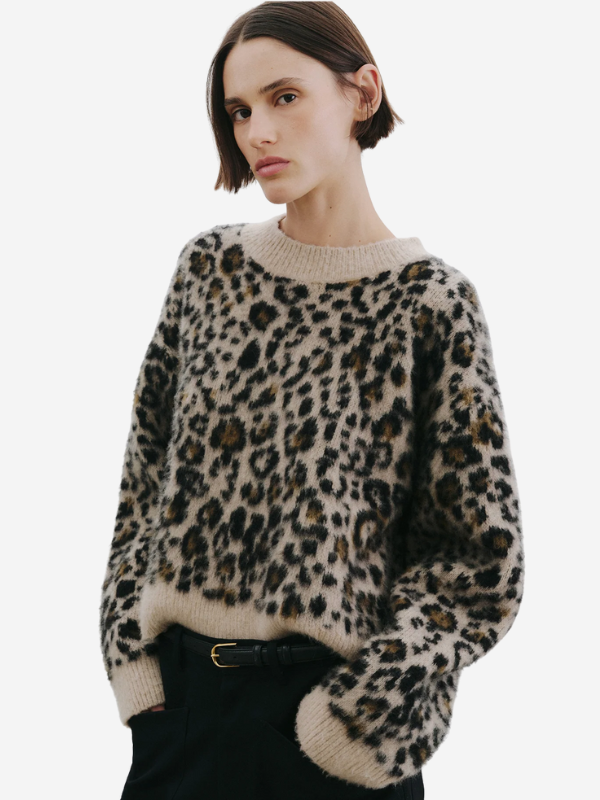 Nili Lotan Zamira Sweater in Jute Leopard displayed on a hanger, highlighting its relaxed boxy fit and elegant design.