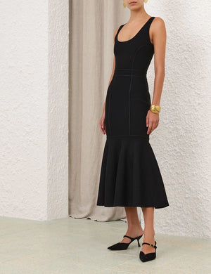 Side view of the Hypnotic Sculptural Midi Dress in Black highlighting its elegant silhouette.
