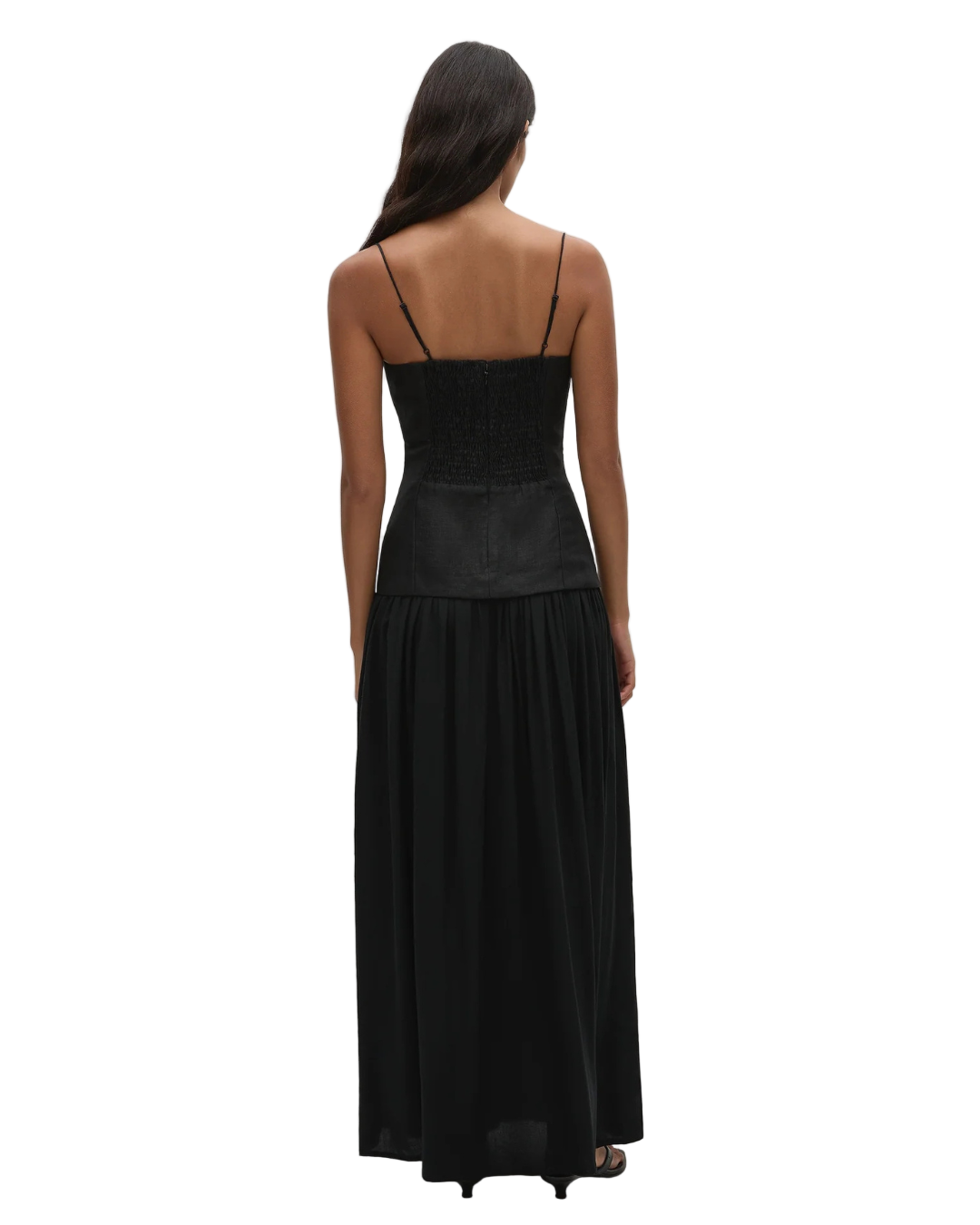 Lenise Maxi Dress in Black with a drop waistline and flowing skirt that grazes the floor, adding elegance to your wardrobe.