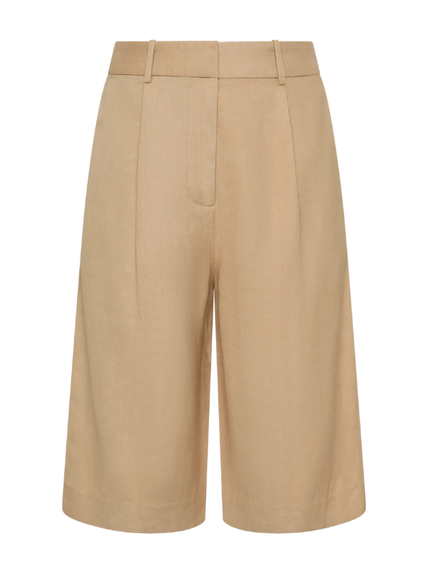 Astrid Shorts in Sahara by FaithFull, showcasing a high-waisted, softly tailored bermuda style with pleats and wide legs.
