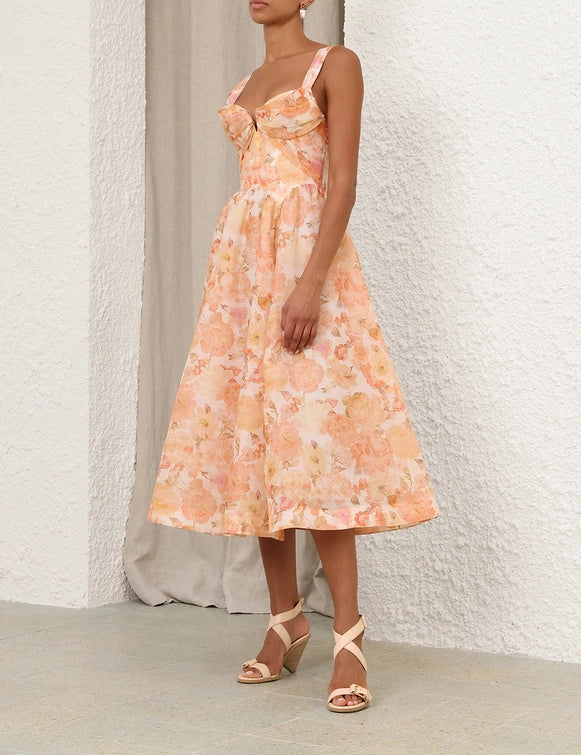Full flared skirt of the Rebellion Drape Midi Dress in Golden Bloom flowing beautifully.