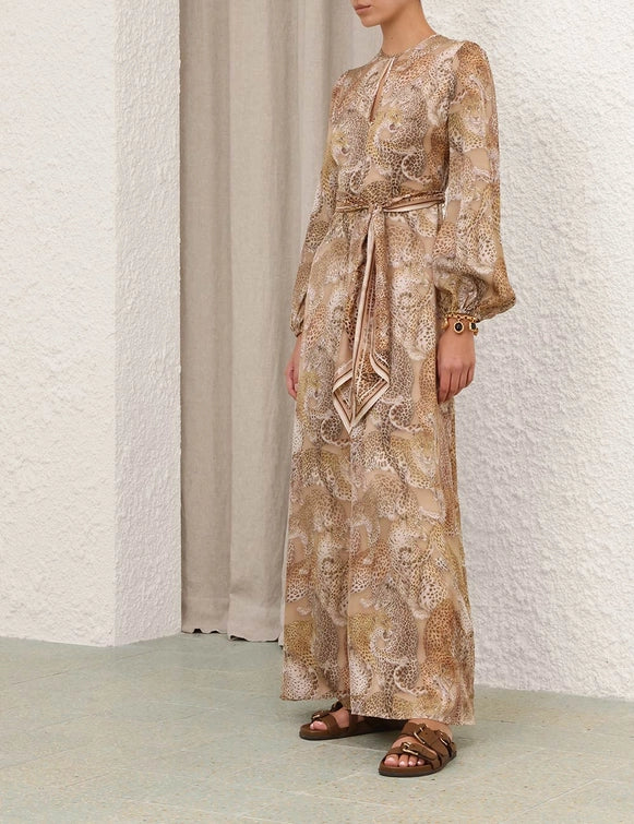 Back view of Rebellion Sheath Dress in Latte Leopard highlighting the unique design and luxurious silk fabric.