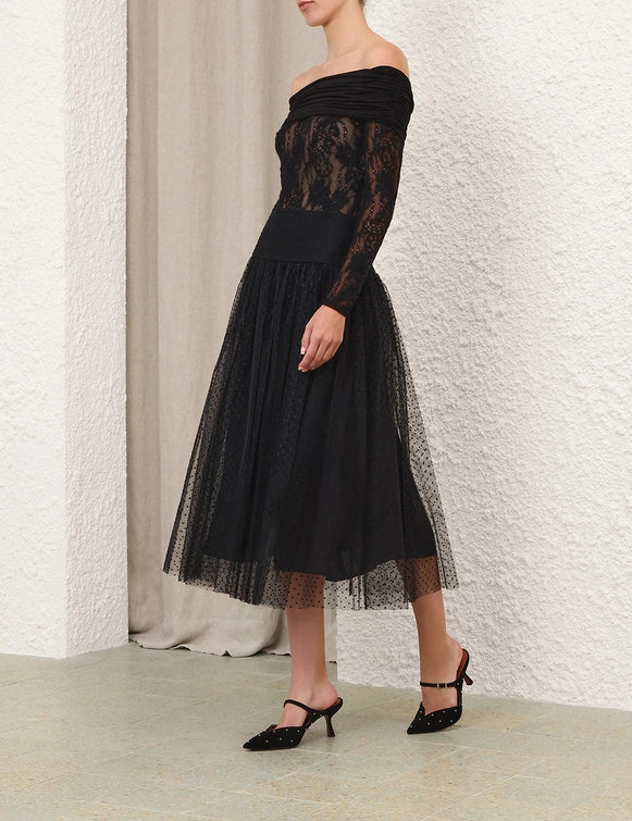 The elegant Tulle Dot Midi Skirt in Black elegantly drapes, perfect for any occasion from Zimmermann's Twisted Romance Collection.