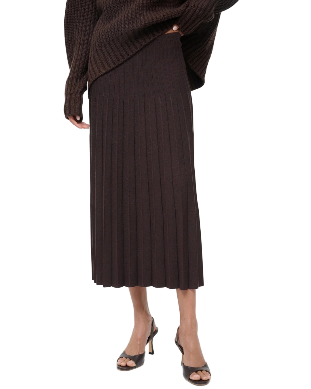 Model wearing the Lena Skirt in Earth by Staud, perfect for a chic and casual look.
