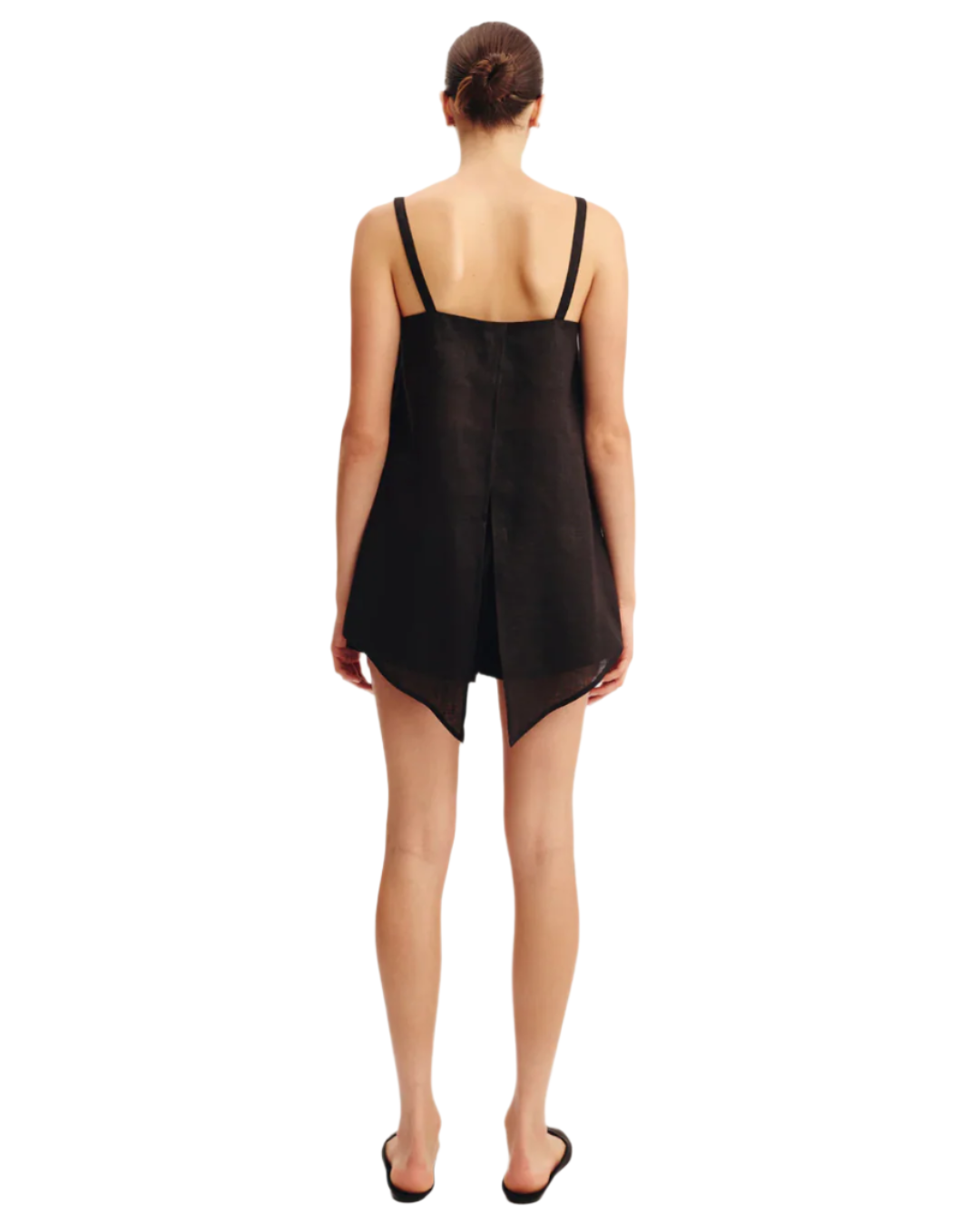 Model wearing the Ginny Top in Black, a chic black linen top perfect for casual outings.