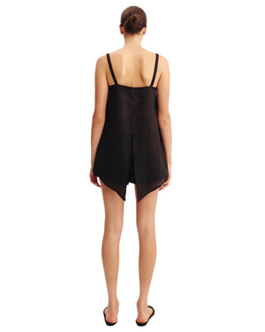 Model wearing the Ginny Top in Black, a chic black linen top perfect for casual outings.
