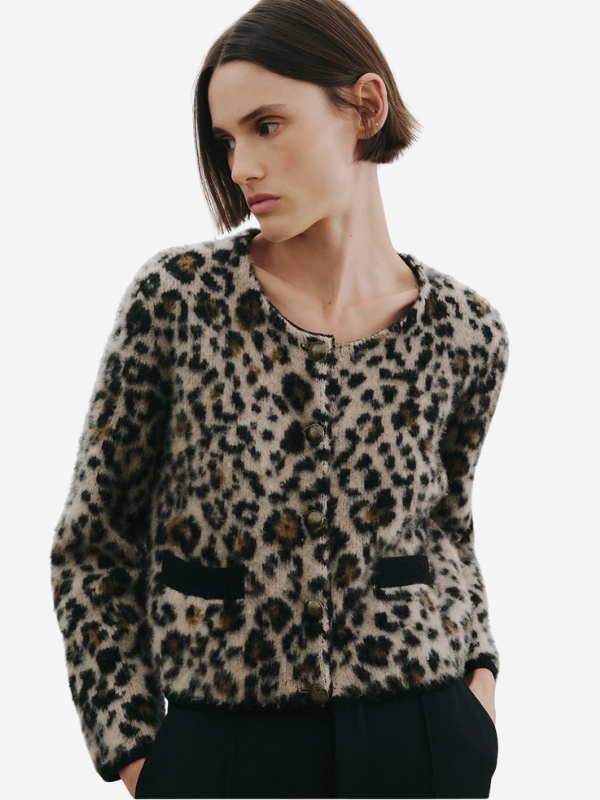 Model wearing the Beyton Cardigan in Jute Leopard styled with casual outfit accessories.