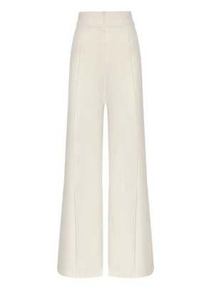 Dedicame pant in Off White by Andres Otalora showcasing sleek high waisted silhouette with soft fabric and structured design.