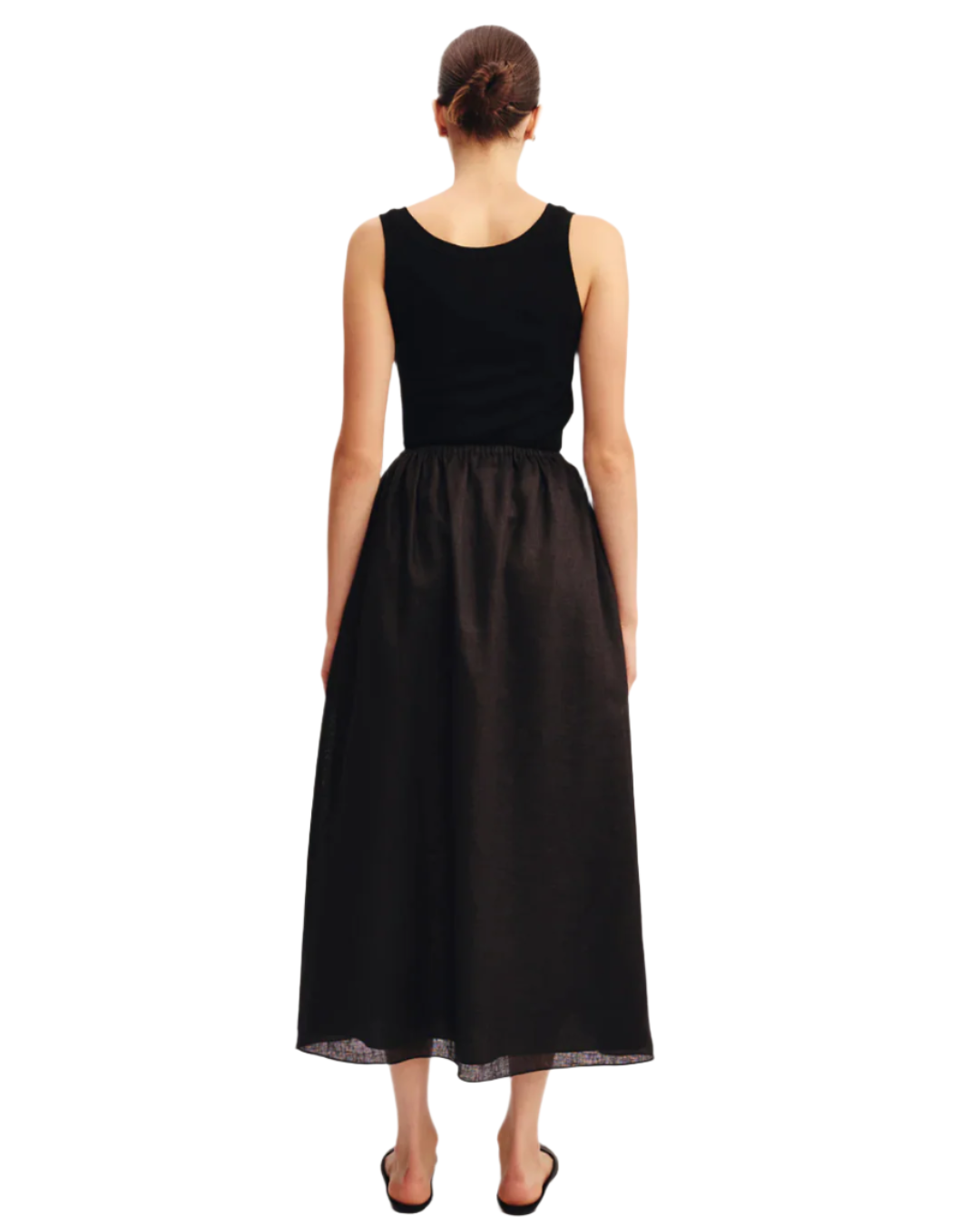 Model wearing the Ginny Skirt in Black, the perfect black linen skirt for casual outings.