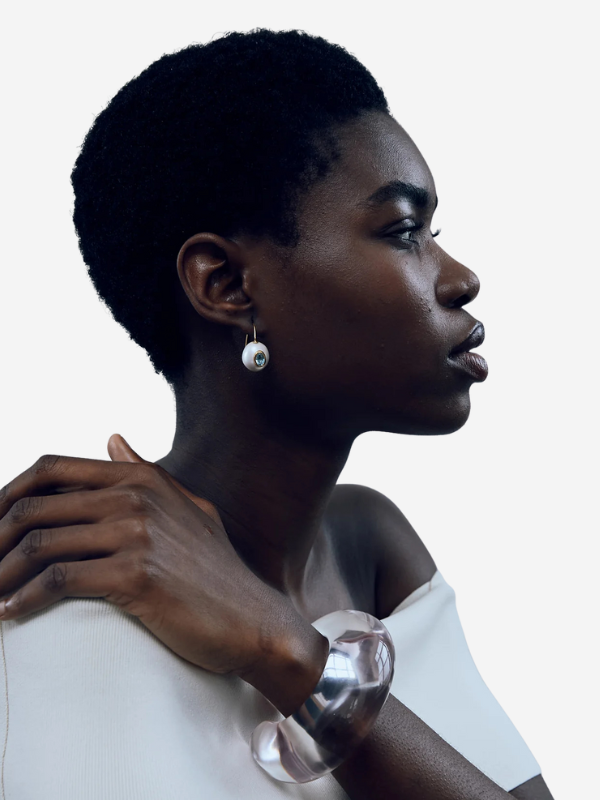 Arc Cuff in Lilac displayed on a minimalist background, emphasizing its elegant form and resin composition.